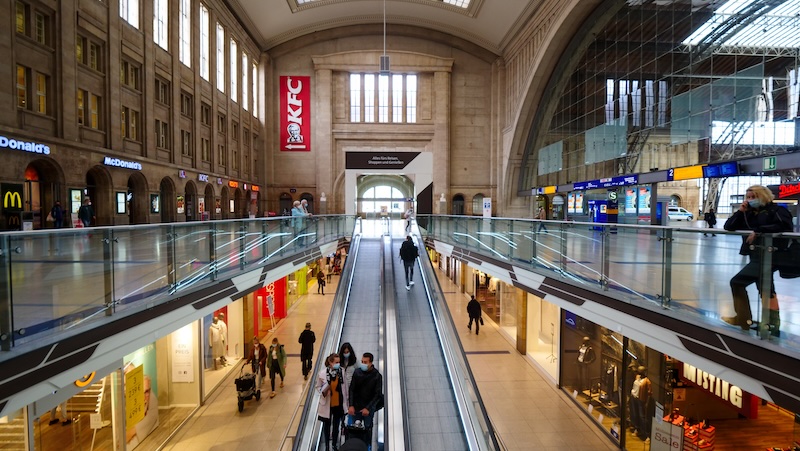 Busy train station scene inside of the Leipzig train station in Germany 
