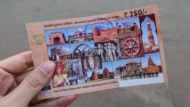 Buying a ticket to the world heritage site in Agra, India 