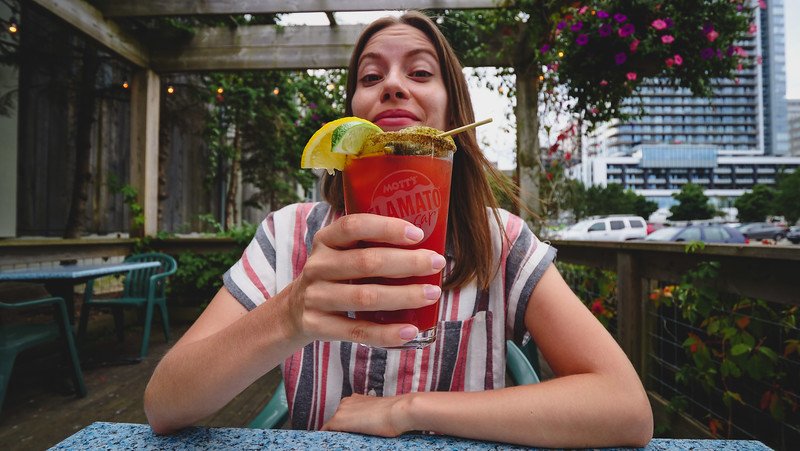 Caesars and seafood at Waterfront Warehouse in Halifax, Nova Scotia with a happy That Backpacker Audrey Bergner delighting her tastebuds 