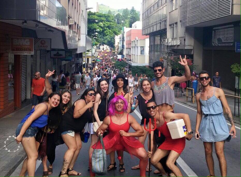 Carnaval in Florianópolis, Brazil with friends all dressed up flamboyantly for the party atmosphere occasion 