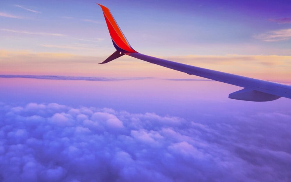 Carry-on Essentials That Make Long-Haul Flights More Bearable! Views from outside the window of our plane during a nice sunset