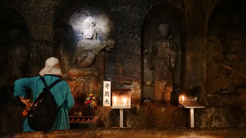 Carvings inside the cave at Hasedera in Kamakura with intricate details on display in Japan on a day trip from Tokyo Carvings inside the cave at Hasedera in Kamakura with intricate details on display in Japan on a day trip from Tokyo