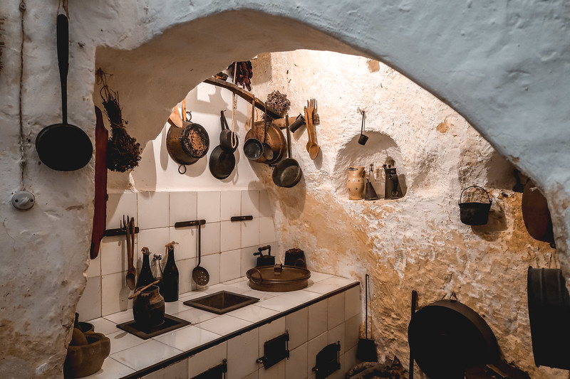 Casa Grotta di Vico Solitario let's you see how locals lived in Matera's cave dwellings including cooking items on display Casa Grotta di Vico Solitario let's you see how locals lived in Matera's cave dwellings including cooking items on display