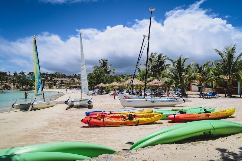 Catamarans, sailboats and kayaks on offer at the beach in Antigua Catamarans, sailboats and kayaks on offer at the beach in Antigua