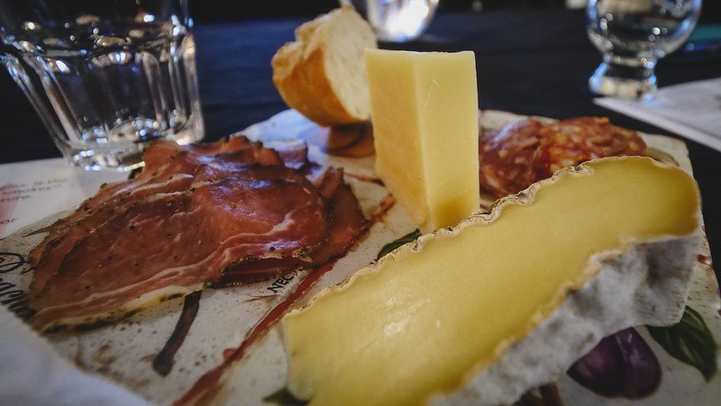 Charcuterie board for the spirits tasting with Compass Distillers in Halifax, Nova Scotia with an assortment of meats and cheeses to sample