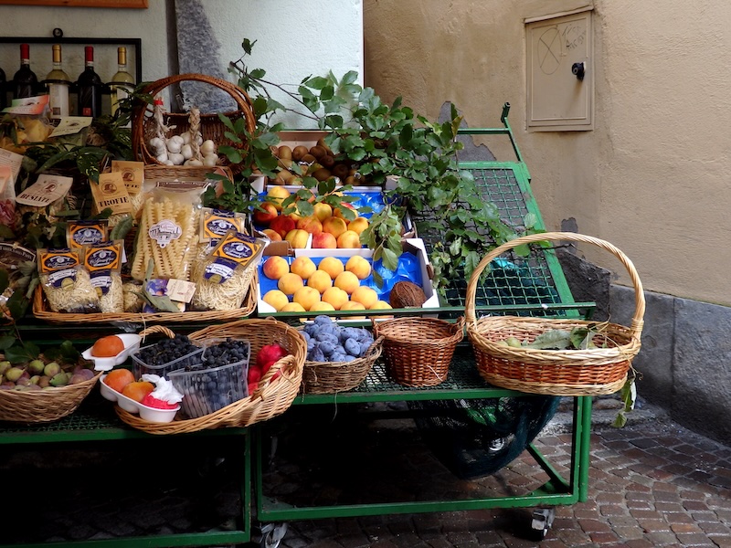 Chiavenna fruits and vegetables on display alongside pastas and wines in Italy 