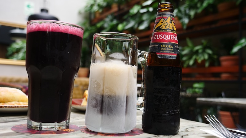 Chicha morrada and Cusquena beer paired next to each other as the most refreshing drinks to try in Miraflores, Lima, Peru 