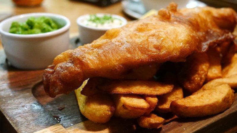 Classic fish and chips with mushy pees in Glasgow, Scotland is the best pub food out there Classic fish and chips with mushy pees in Glasgow, Scotland is the best pub food out there