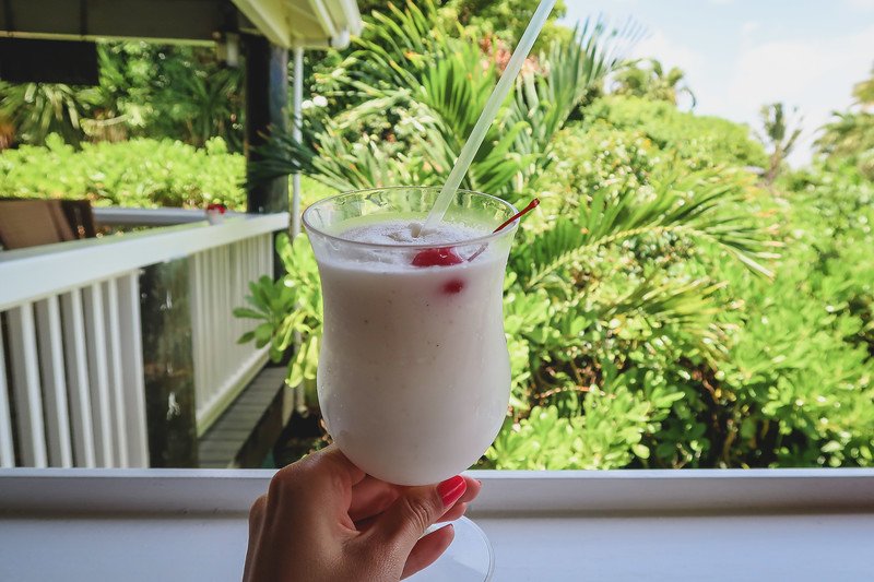 Coconut smoothies with a cherry at the resort in Antigua overlooking the balcony Coconut smoothies with a cherry at the resort in Antigua overlooking the balcony
