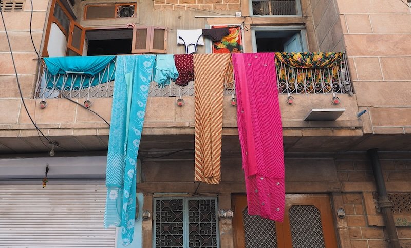 Colorful laundry hanging from the balcony in Jodhpur, Rajasthan, India 