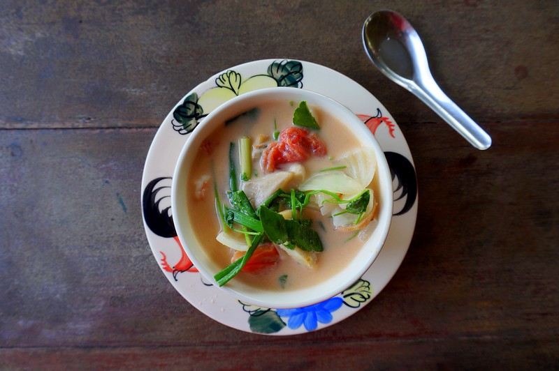 Cooking Tom Yam Kung a coconut based soup with shrimp in Chiang Mai in Thailand