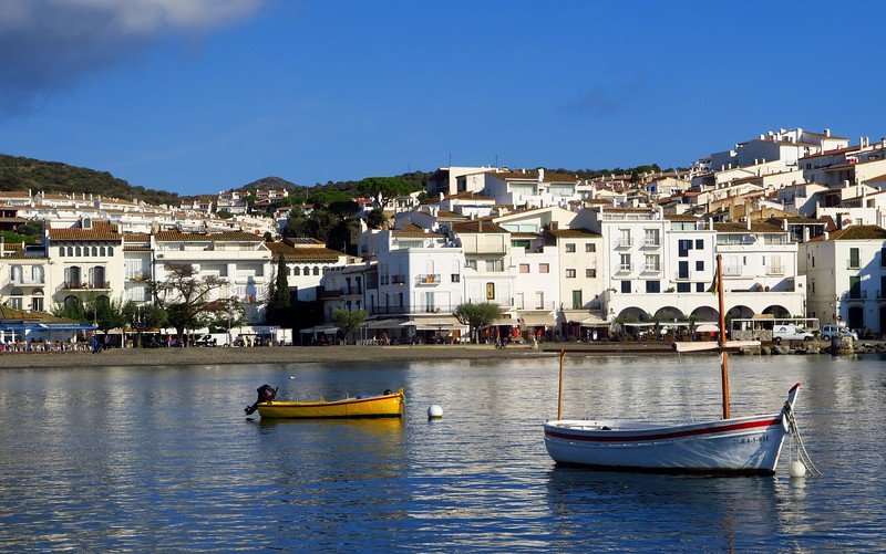 Costa Brava Travel Guide: The Art of Experiential Travel in Costa Brava. The seaside town of Cadaques, Spain all painted white.