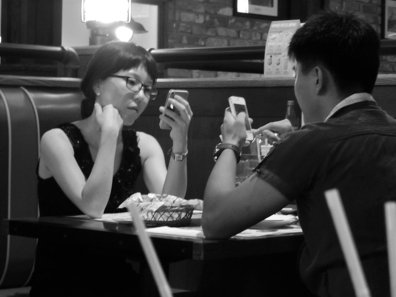Couple on a Date with their Cellphones in Seoul, South Korea 