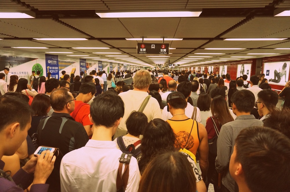 Crazy metro MRT crowds in Hong Kong as we are on our way to eat in the city 