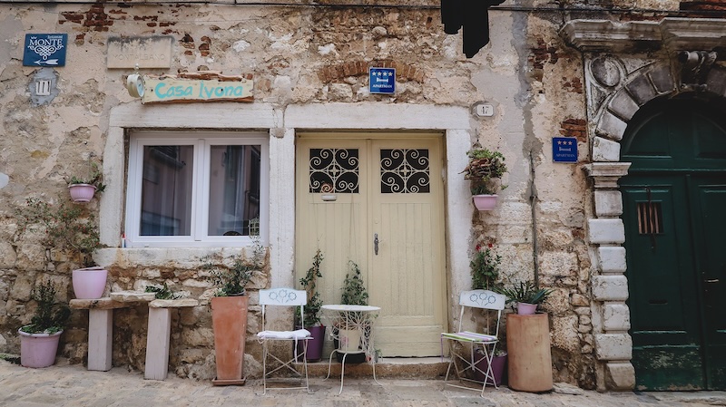 Cute local accommodations in Rovinj, Croatia with charis outside of the door 