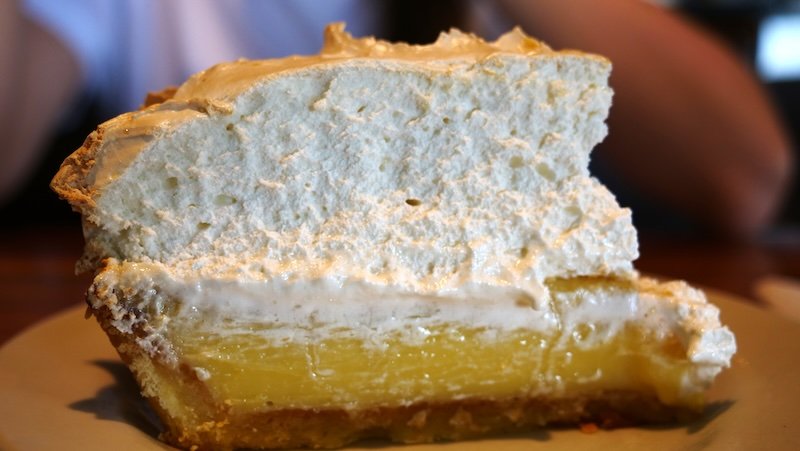 Decadent desserts in Lima, Peru including a giant slice of Lemon merengue pie 