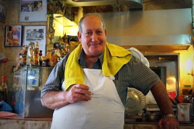 Dewan Al Saraya friendly local face with drink in hand in Nazareth, Israel 
