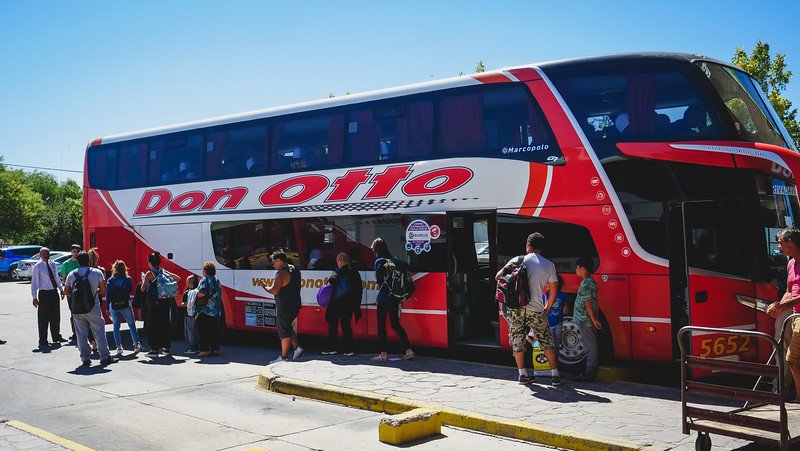 Travelers boarding a Don Otto long-distance double-decker bus to Puerto Madryn, Patagonia, Argentina. Comfortable overnight buses are one of the most popular ways to reach Puerto Madryn from Buenos Aires or other cities in Argentina