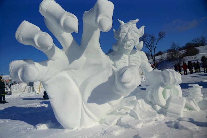 Dramatic and creative ice sculptures in Quebec City Carnaval demon figure Dramatic and creative ice sculptures in Quebec City Carnaval demon figure