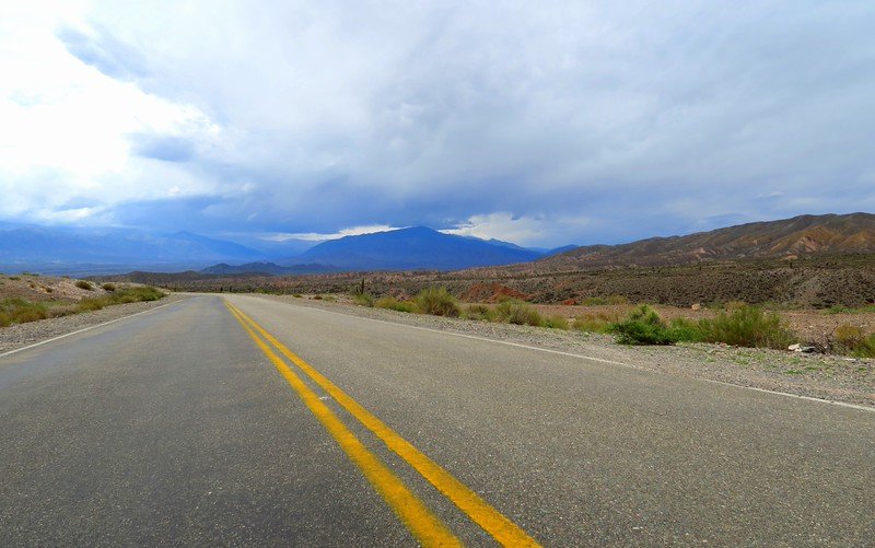 Driving to Cachi, Argentina on a road trip with views of the highway and mountain views along the way 