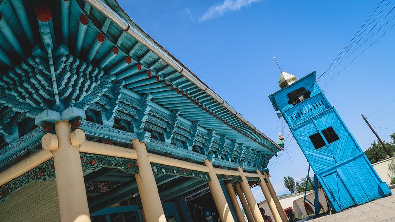 Dungan Mosque in Karakol, Kyrgyzstan with its distinctly blue colour and intricate details from a unique vantage point low to the ground