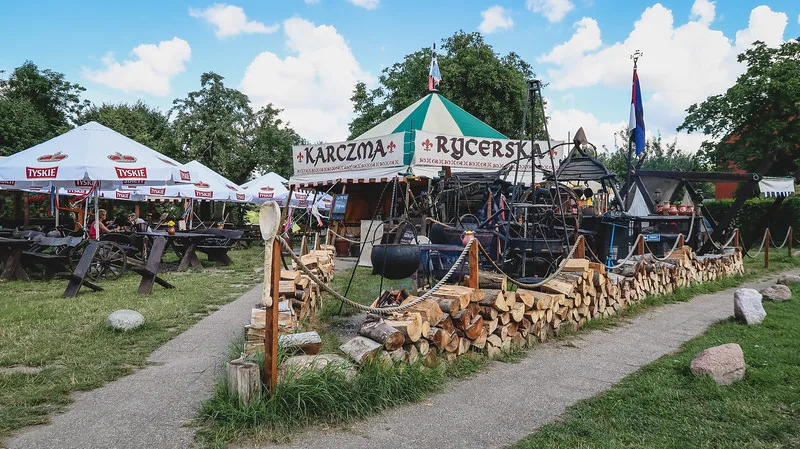 Eating at a Medieval restaurant in Malbork Castle in the outdoor food court style area in Poland