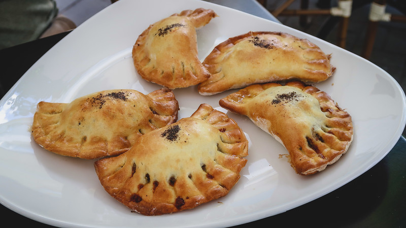 Eating baked pierogi in Sopot, Poland served on a plate and ever so tasty
