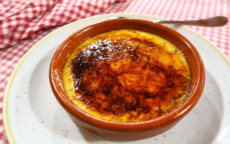 Eating Crema catalana in Costa Brava for a decadent dessert and sweet way to end the meal