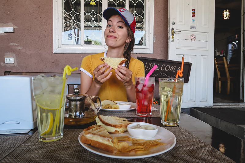 Eating delicious sandwiches in Karakol at Fat Cat Cafe where comfort food and drinks are served in Kyrgyzstan 