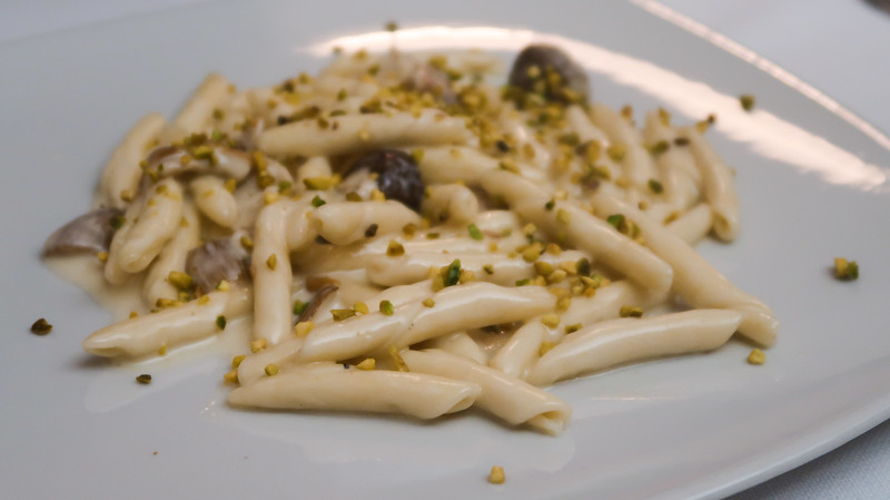 Eating Materan pasta at La Grotta de Sassi sprinkled with pine nut Eating Materan pasta at La Grotta de Sassi sprinkled with pine nut