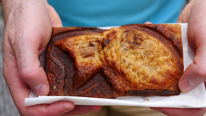 Eating street food desserts in Kamakura, Japan such as this fish shaped pastry with red bean paste inside Eating street food desserts in Kamakura, Japan such as this fish shaped pastry with red bean paste inside