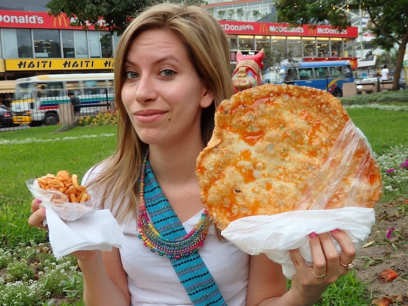 Eating street food snacks in Lima, Peru giant torrones is That Backpacker Audrey Bernger 