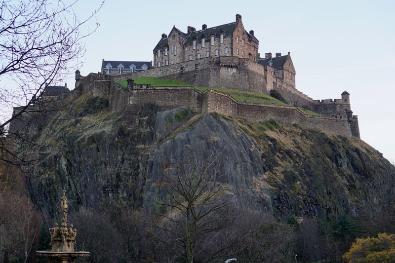 Edinburgh Castle Princes Street Gardens in Scotland from a ground level vantage point looking upwards