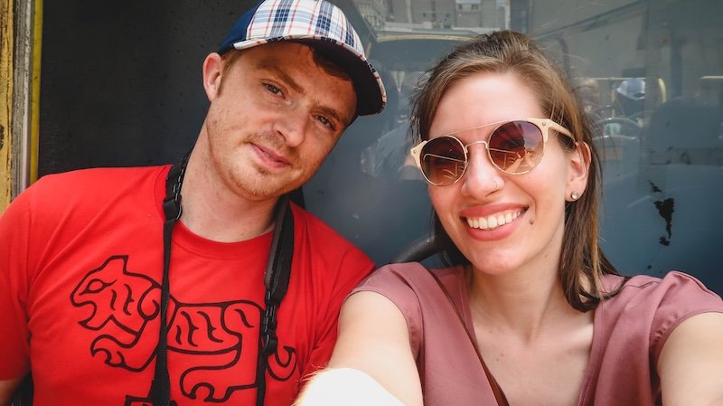 Enjoying a city bus tour to sightsee in Lima, Peru is Nomadic Samuel and Audrey Bergner That Backpacker 