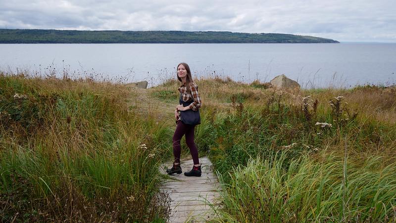 Enjoying the seaside views on the Celtic Shores Coastal Trail is a happy That Backpacker Audrey Bergner whilst visiting Cape Breton