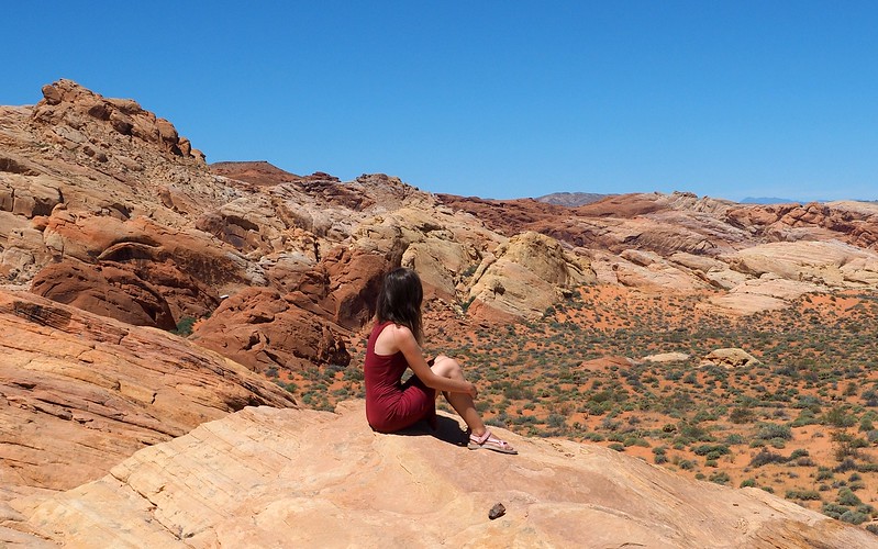 Enjoying the views on our day trip to Valley of Fire State Park with That Backpacker Audrey Bergner posing on the rock Enjoying the views on our day trip to Valley of Fire State Park with That Backpacker Audrey Bergner posing on the rock