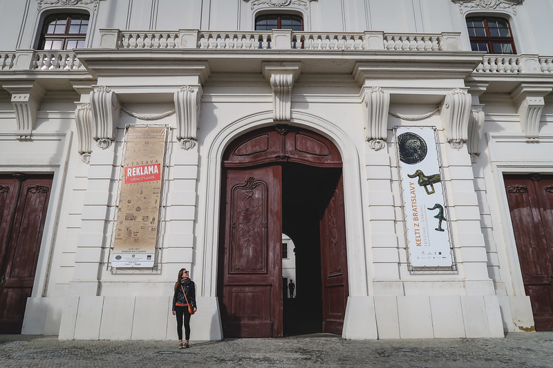 Entrance to Bratislava Castle with That Backpacker Audrey Bergner looking tiny by the massive door Entrance to Bratislava Castle with That Backpacker Audrey Bergner looking tiny by the massive door