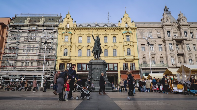 Family with a stroller visiting downtown historic city centre of Zagreb, Croatia 