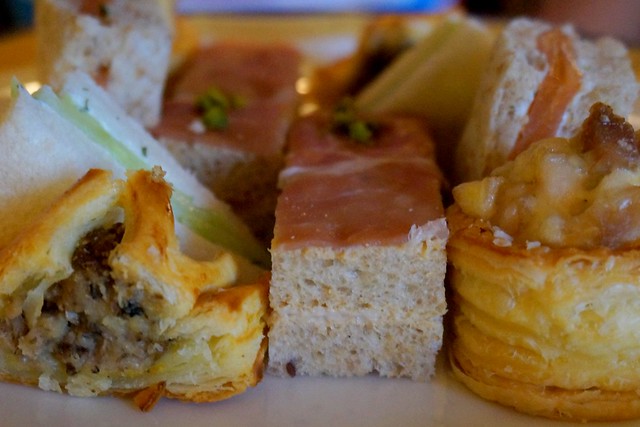 Finger sandwiches with salmon, cucumber, and prosciutto during afternoon tea at The Peninsula Hotel in Hong Kong.