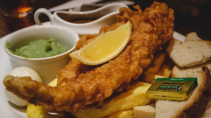 Fish and chips is the ultimate pub food and comfort cuisine experience on a day trip from London, England Fish and chips is the ultimate pub food and comfort cuisine experience on a day trip from London, England