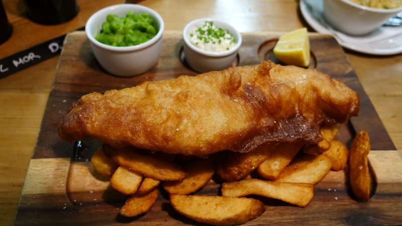Fish and chips served with mushy pees is the ultimate cheat day meal in Glasgow, Scotland Fish and chips served with mushy pees is the ultimate cheat day meal in Glasgow, Scotland