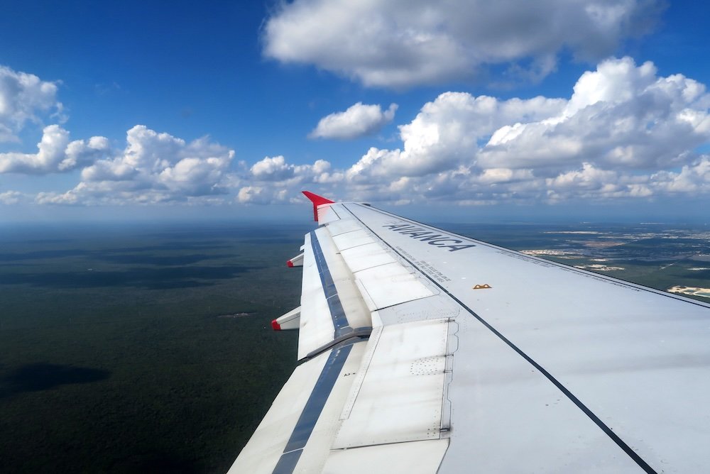 Flight to Mexico with clouds in the sky 