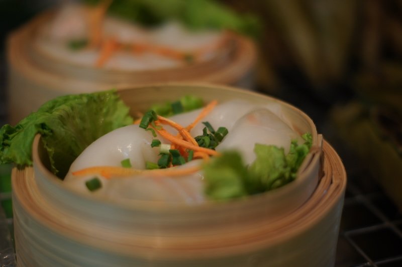 Fresh spring rolls in a wicker basket at the Chiang Mai Saturday Night Market in Thailand 