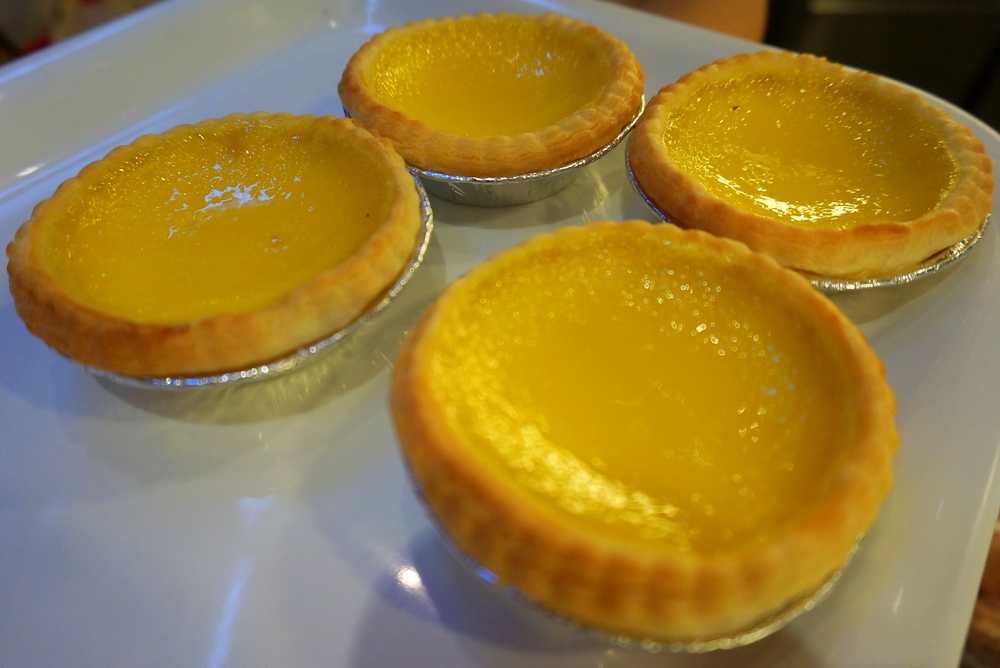 Freshly baked egg tarts in Hong Kong which is a perfect dessert or breakfast or snack for a true foodie in Hong Kong 