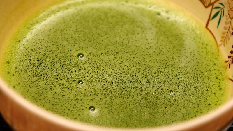 Frothy matcha tea in a cup in Takayama, Japan Frothy matcha tea in a cup in Takayama, Japan