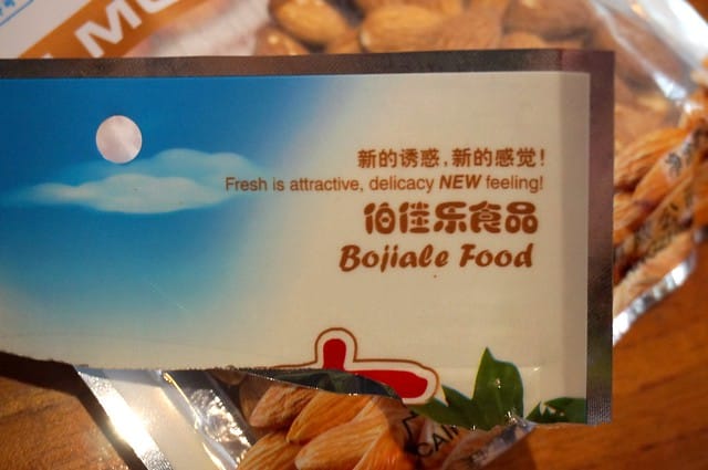 Funny engrish sign on Chinese food package saying fresh is attractive, delicacy new feeling