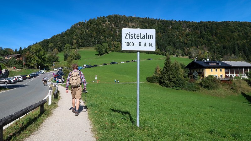 Gaisberg Zistelalm is one of the trailheads to Gaisberg with Nomadic Samuel walking towards the trail in Austria