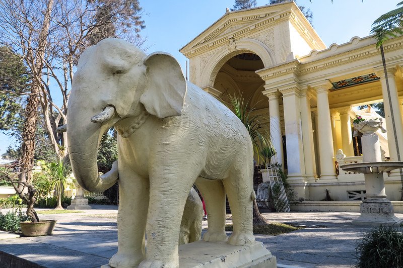 Elephant statue in the Garden of Dreams, Kathmandu, Nepal standing beside neoclassical architecture and lush greenery