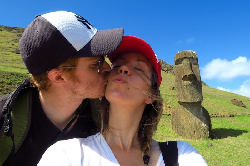 Getting a kiss on Easter Island Rapa Nui by the Moai statue featuring Nomadic Samuel and Audrey Bergner That Backpacker