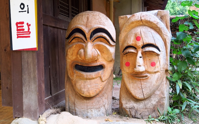 Giant Korean traditional folk masks carved out at the Korean Folk Village in Yongin, South Korea 